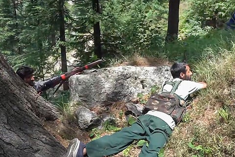 Guards keep vigil at a forest area in Doda